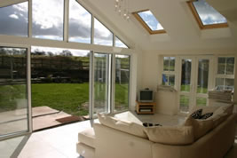A brick and glass rear conservatory in Holmes Chapel by KJB Builders