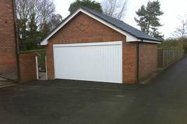 Detached garage to side of house in Wilmslow by KJB Builders