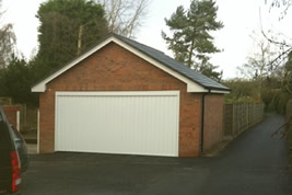 Detached garage to side of house in Wilmslow by KJB Builders