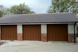 Triple garage built in garden in Adlington by KJB Builders