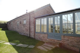 A barn conversion and renovation in Wild Boar Clough by KJB Builders