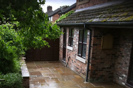 Patio landscaping to rear in Alderley Edge by KJB Builders