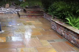 Patio landscaping to rear in Alderley Edge by KJB Builders