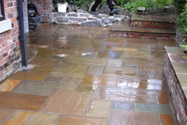 Patio landscaping to rear in Alderley Edge by KJB Builders